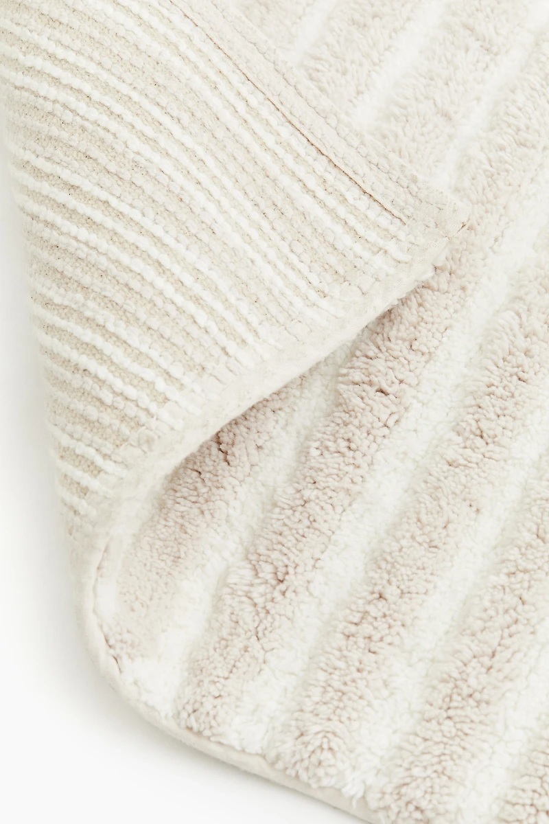 Tapis de bain en coton touffeté