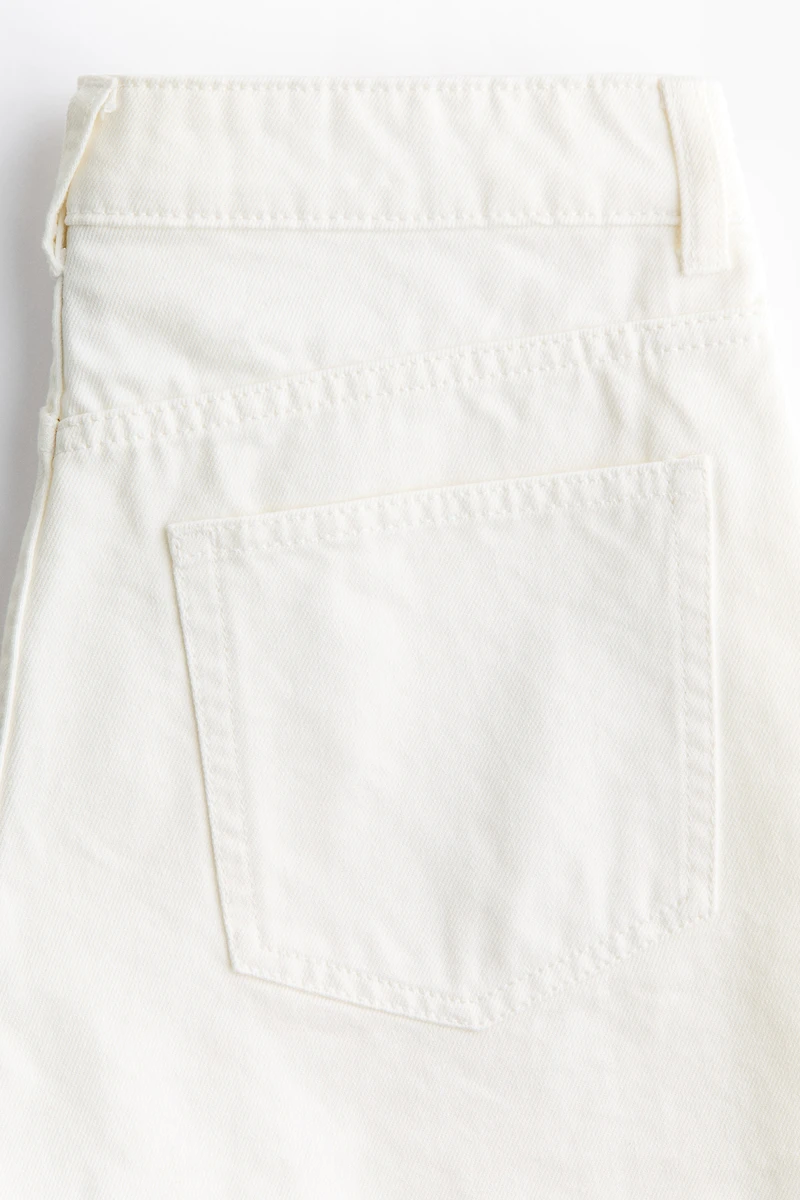 Raw-edge denim shorts