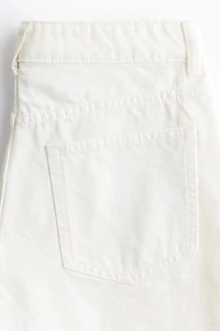 Raw-edge denim shorts