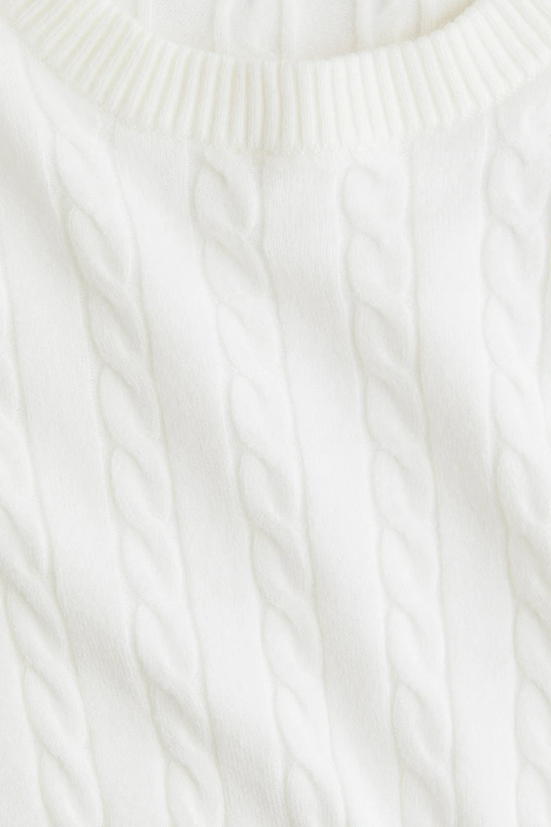 Haut court en tricot torsadé