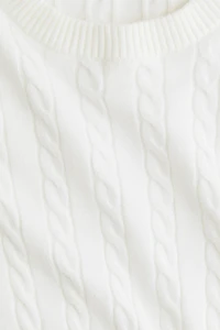 Haut court en tricot torsadé