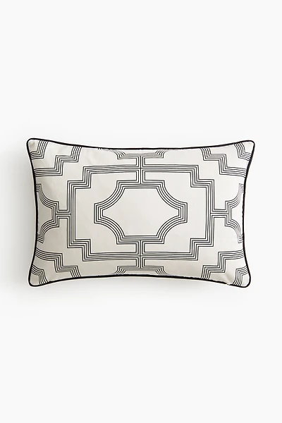 Housse de coussin en satin à motif