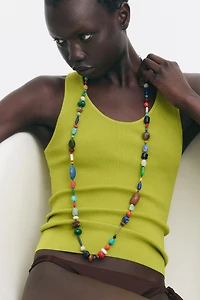 Long collier avec perles fantaisie