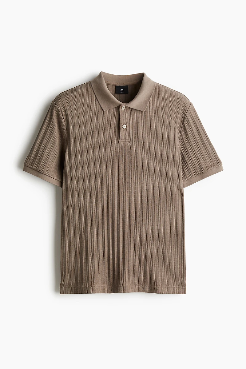 Polo près du corps en jersey texturé