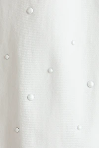 Pantalon évasé avec perles de fantaisie