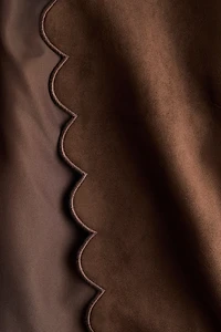 Veste à bords festonnés