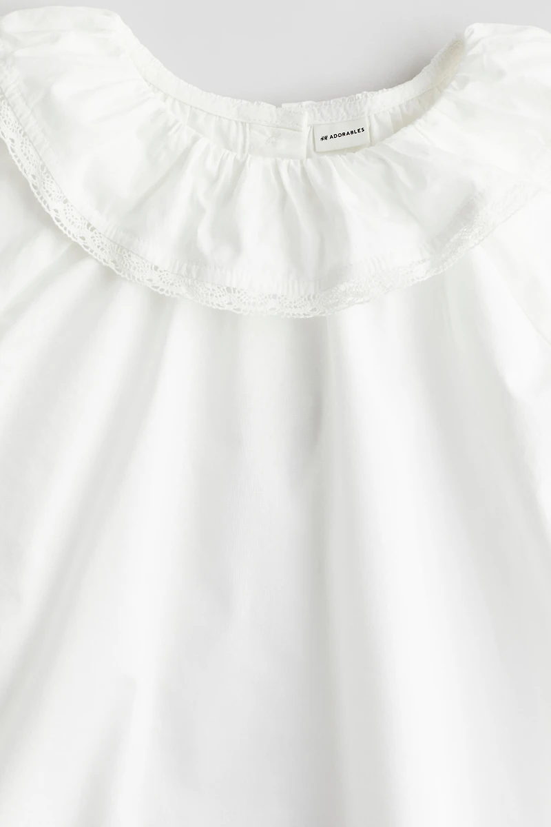 Blouse en coton avec col à volant
