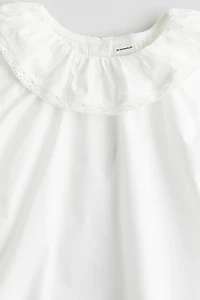 Blouse en coton avec col à volant
