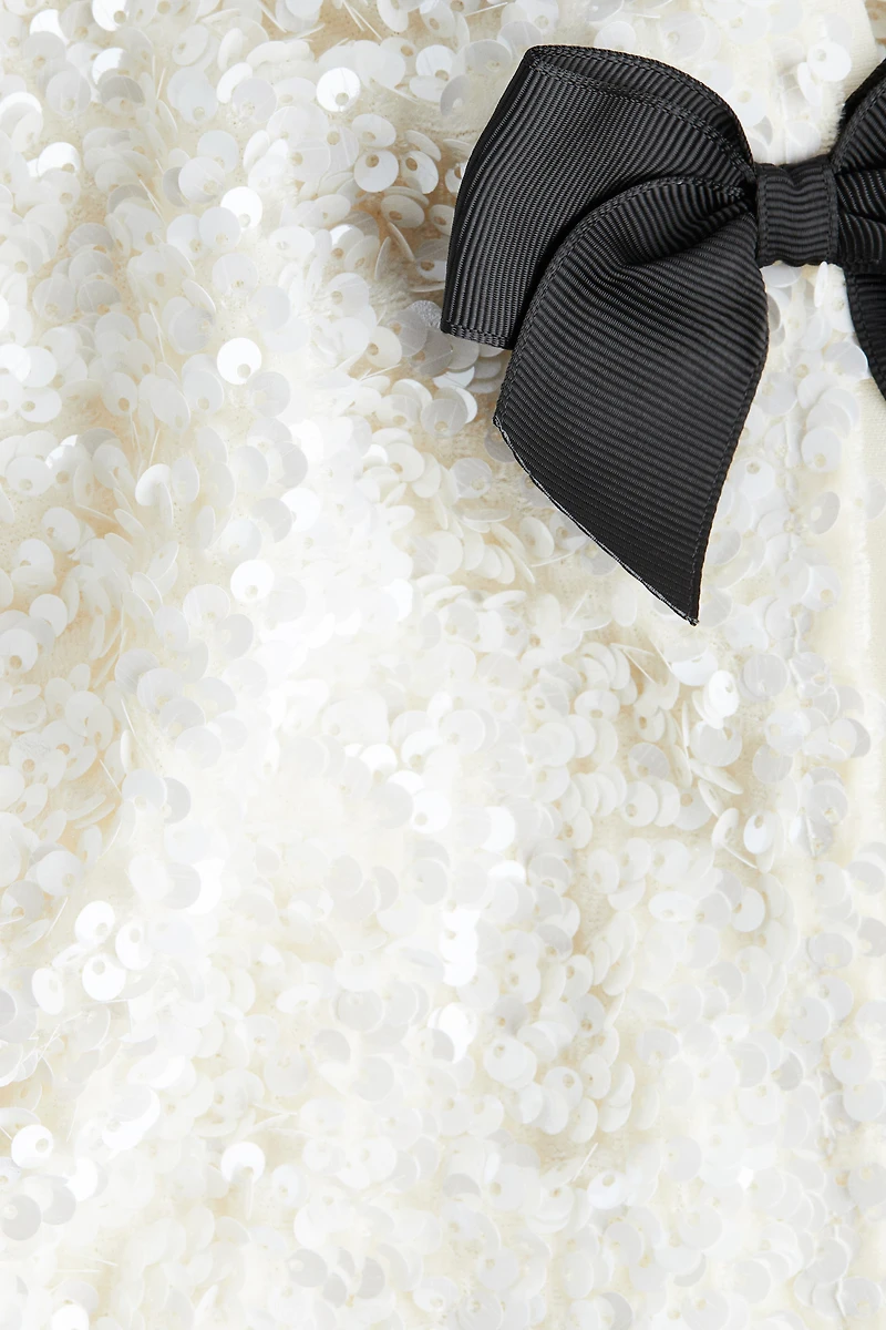 Veste à sequins avec boucles