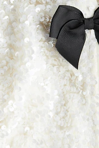 Veste à sequins avec boucles