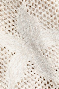 Robe en tricot ajouré avec motifs