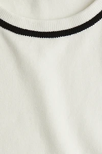 Chandail sans manches en fin tricot