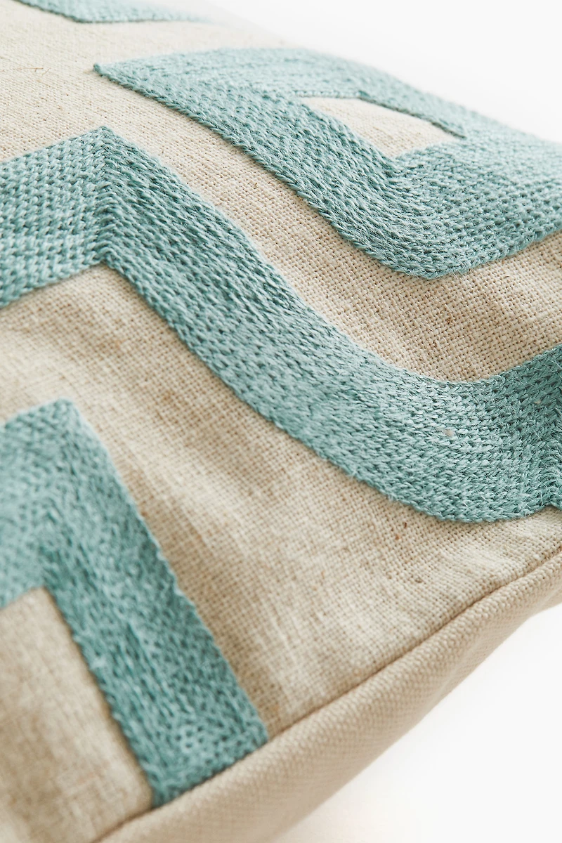 Housse de coussin à motif