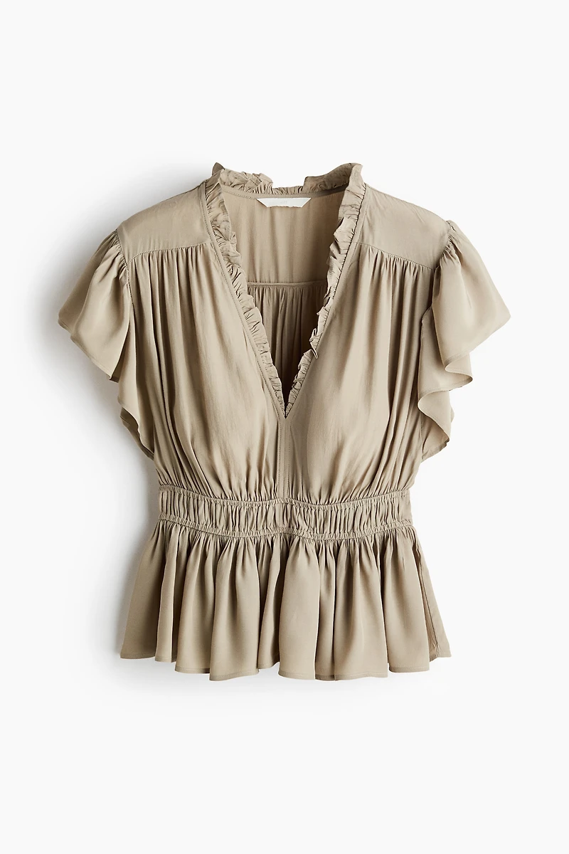 Blouse à manches volantées avec basque