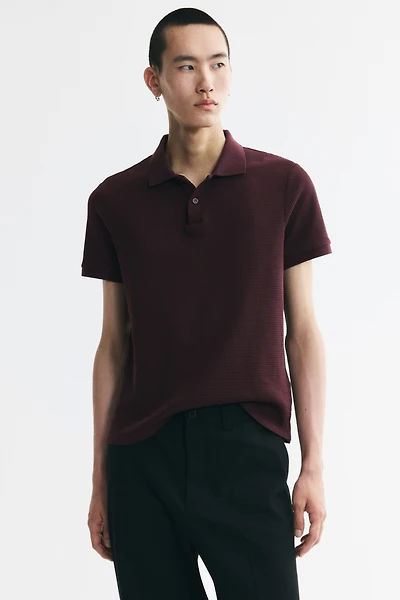 Polo près du corps en tricot gaufré
