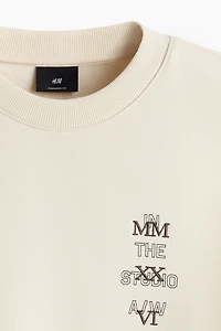 Chandail ample en molleton imprimé