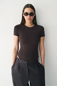 Maillot Tanga moulant à manches courtes