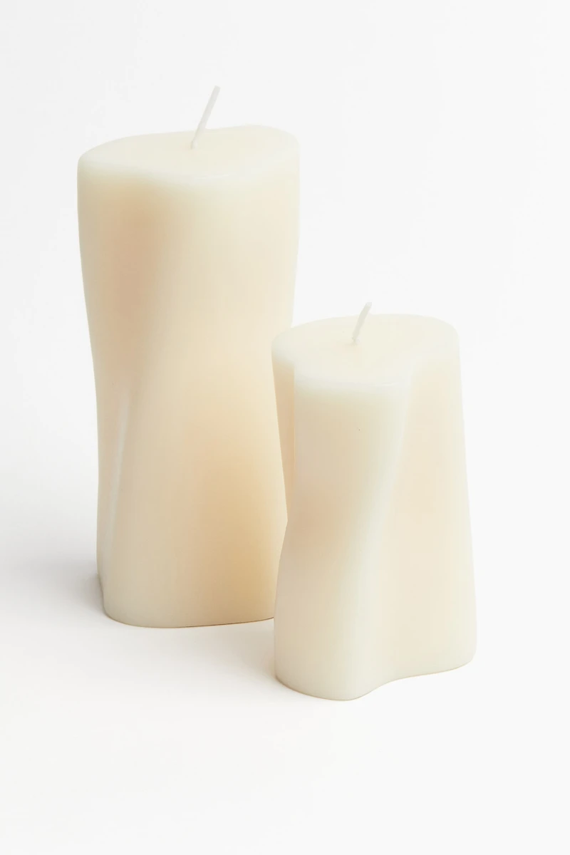 Bougie pilier asymétrique