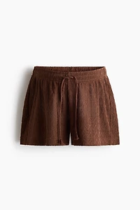 MAMA Short à cordon en tricot pointelle