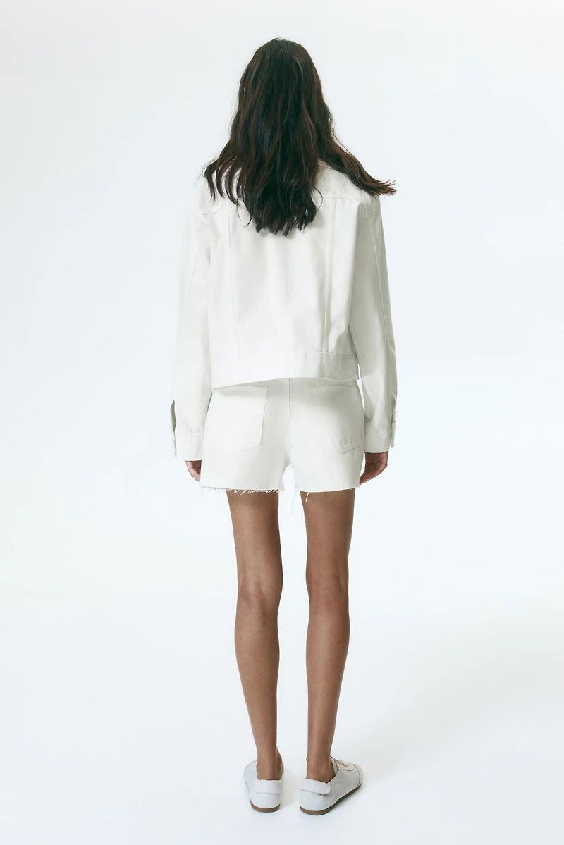 Raw-edge denim shorts