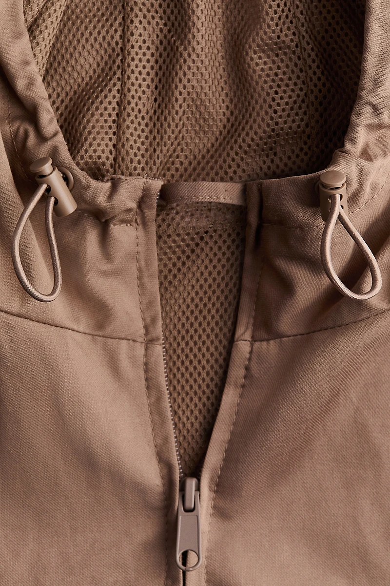 Veste coupe-vent à capuche