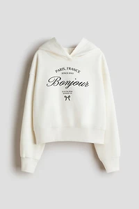 Chandail à capuche avec un motif