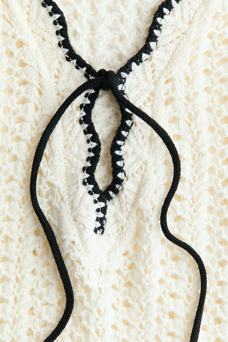 Robe de plage en tricot pointelle