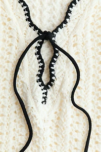 Robe de plage en tricot pointelle