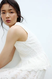 Haut péplum en tricot pointelle