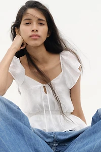 Blouse à manches volantées avec basque