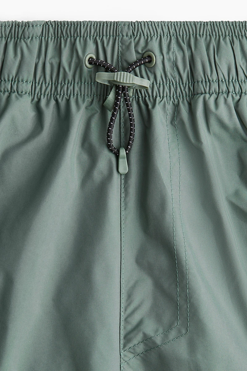 Short de sport long style cargo