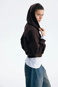 Veste courte à fermeture éclair avec capuche