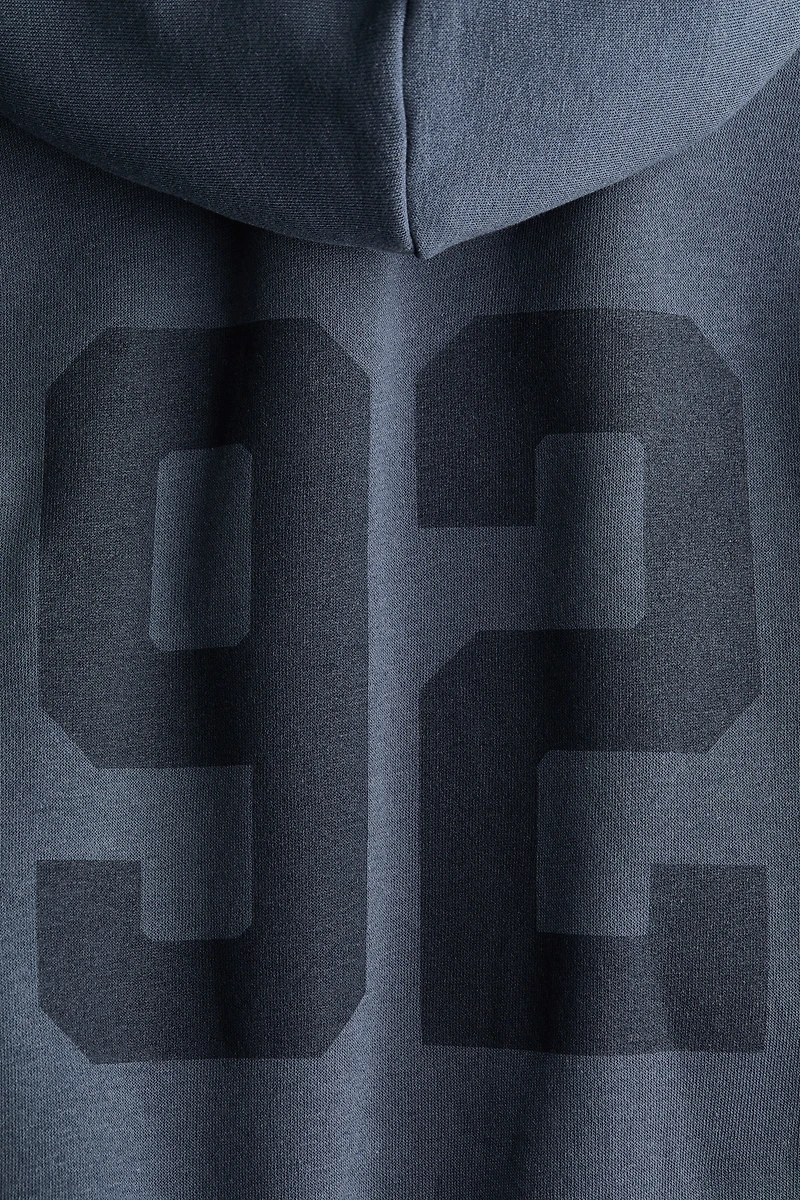 Veste ample avec capuche et fermeture éclair