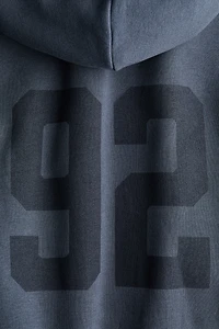 Veste ample avec capuche et fermeture éclair