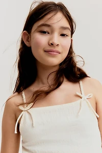 Haut péplum avec boucles