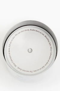 Bougie parfumée dans un pot en acier inoxydable
