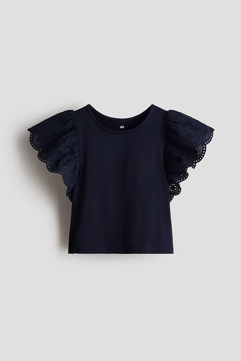 Haut à manches volantées avec broderie anglaise