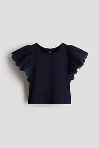 Haut à manches volantées avec broderie anglaise