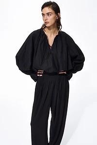 Pantalon plissé à jambes tonneau