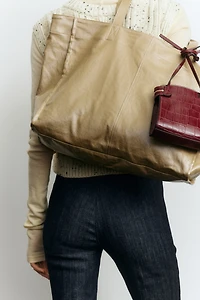 Jean aux chevilles évasé taille haute