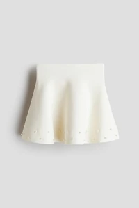 Jupe en tricot fin avec perles fantaisie