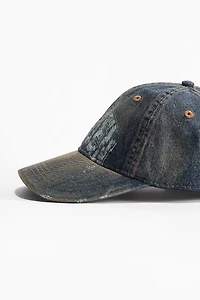 Casquette avec détails fortement usés