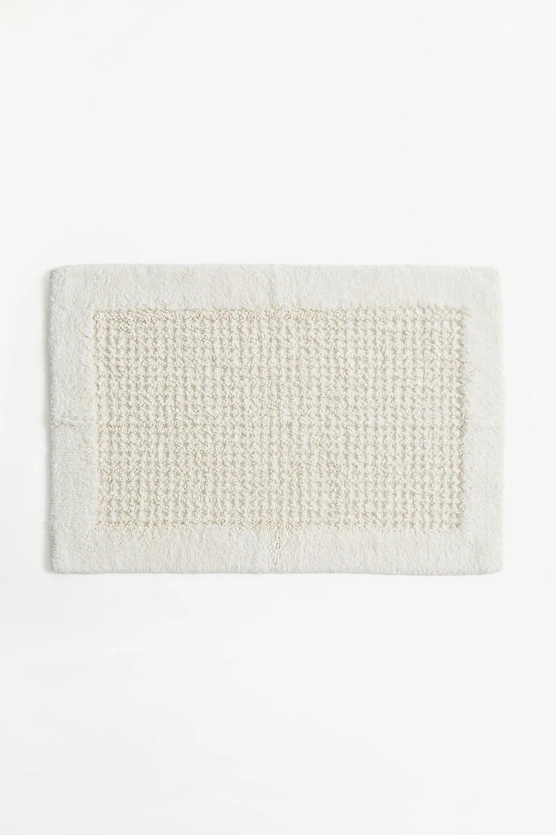 Tapis de bain en coton touffeté