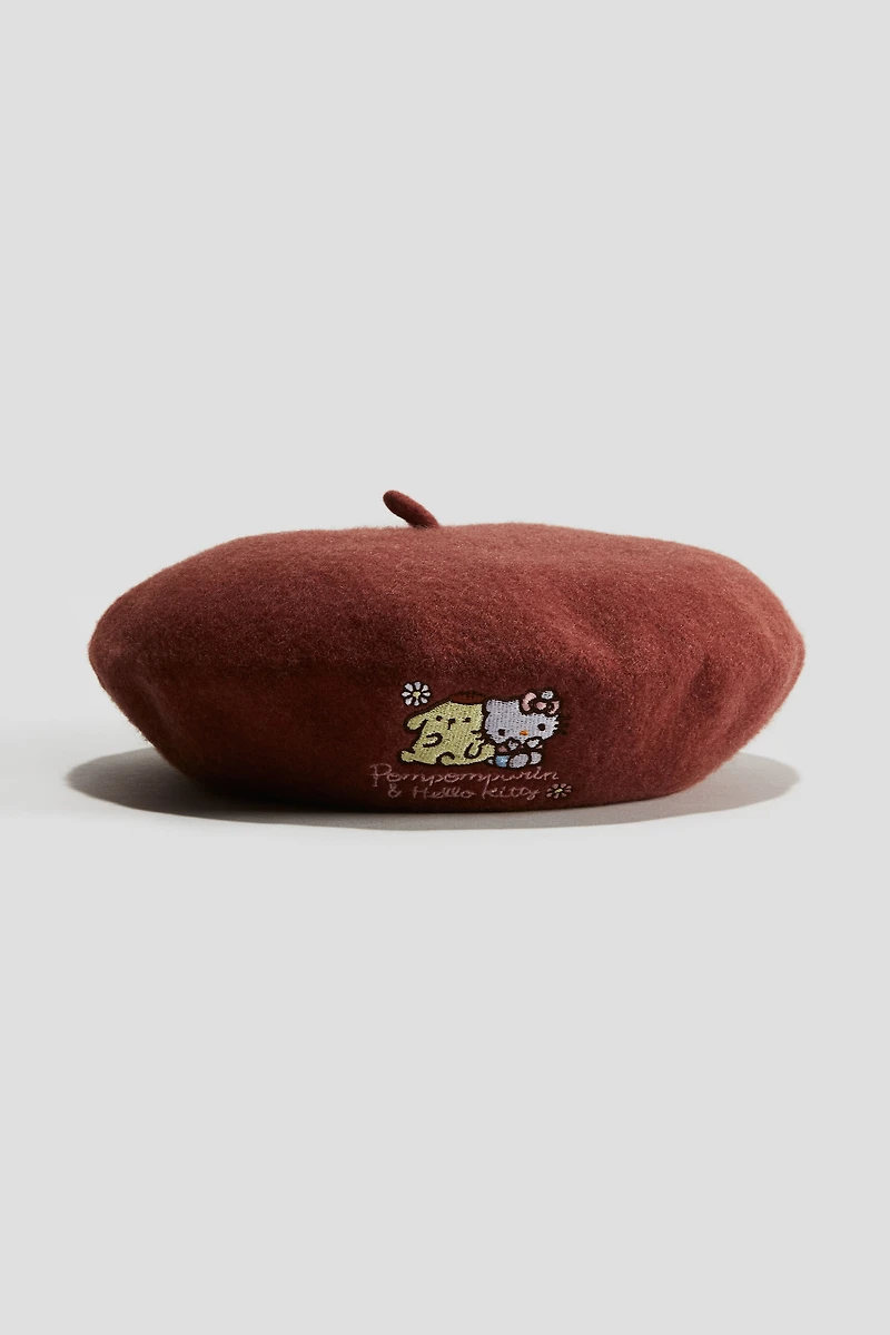 Béret en laine avec appliqué