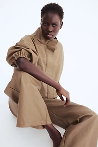 Pantalon en tissu enduit