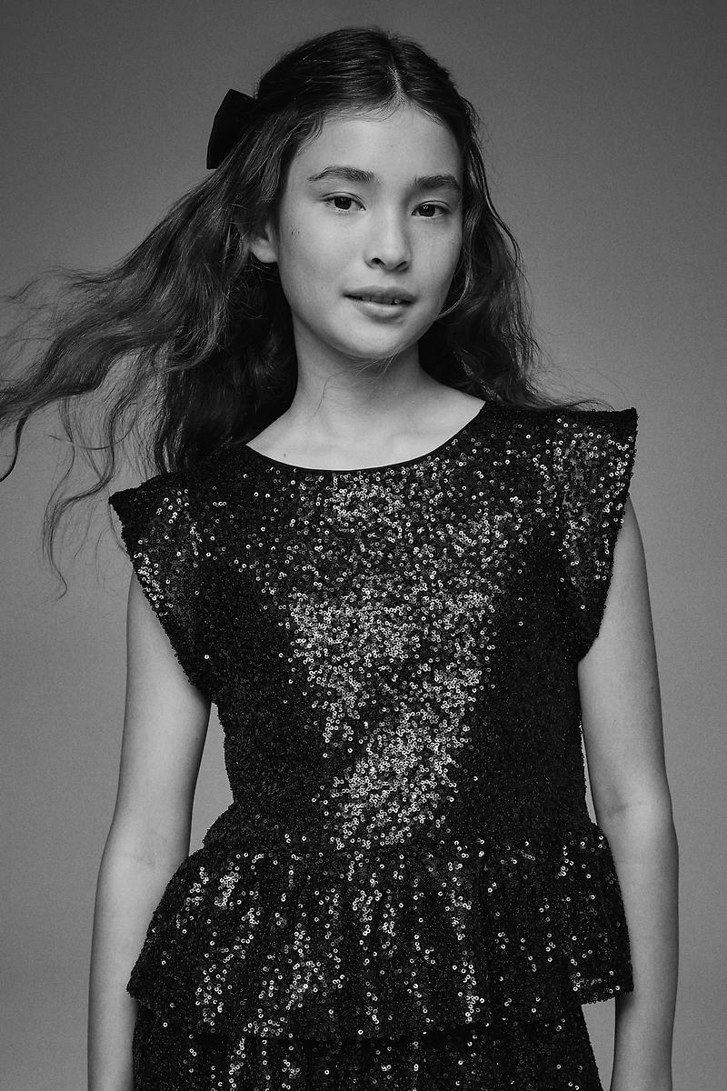 Haut péplum à sequins