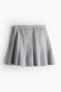 Jupe plissée en textile façon néoprène