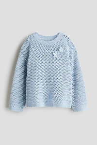 Chandail en tricot de coton ajourée