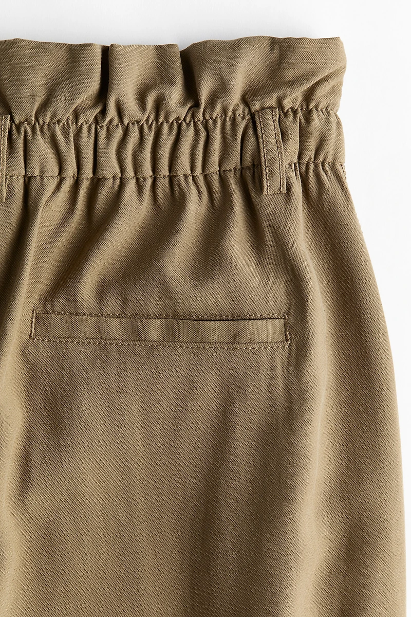 Pantalon taille froncée avec jambes tonneau