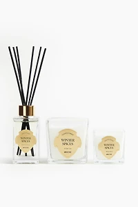 Petite bougie parfumée dans un pot en verre